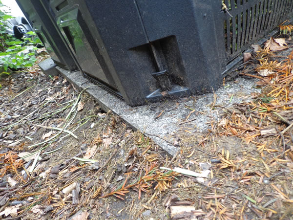 Compostbak op tegels